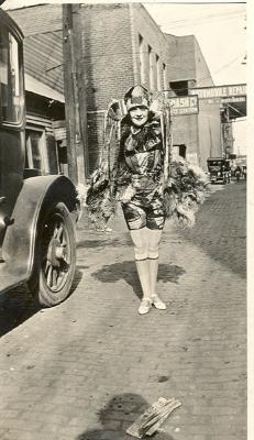 Unidentified woman standing near Jackson Wagon
