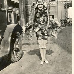 Unidentified woman standing near Jackson Wagon