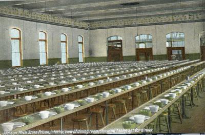 Jackson, Mich. State Prison, interior, view of dining room, showing tables set for dinner.