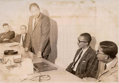 Men with carousel slide projector