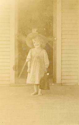 Unidentified girl on a porch